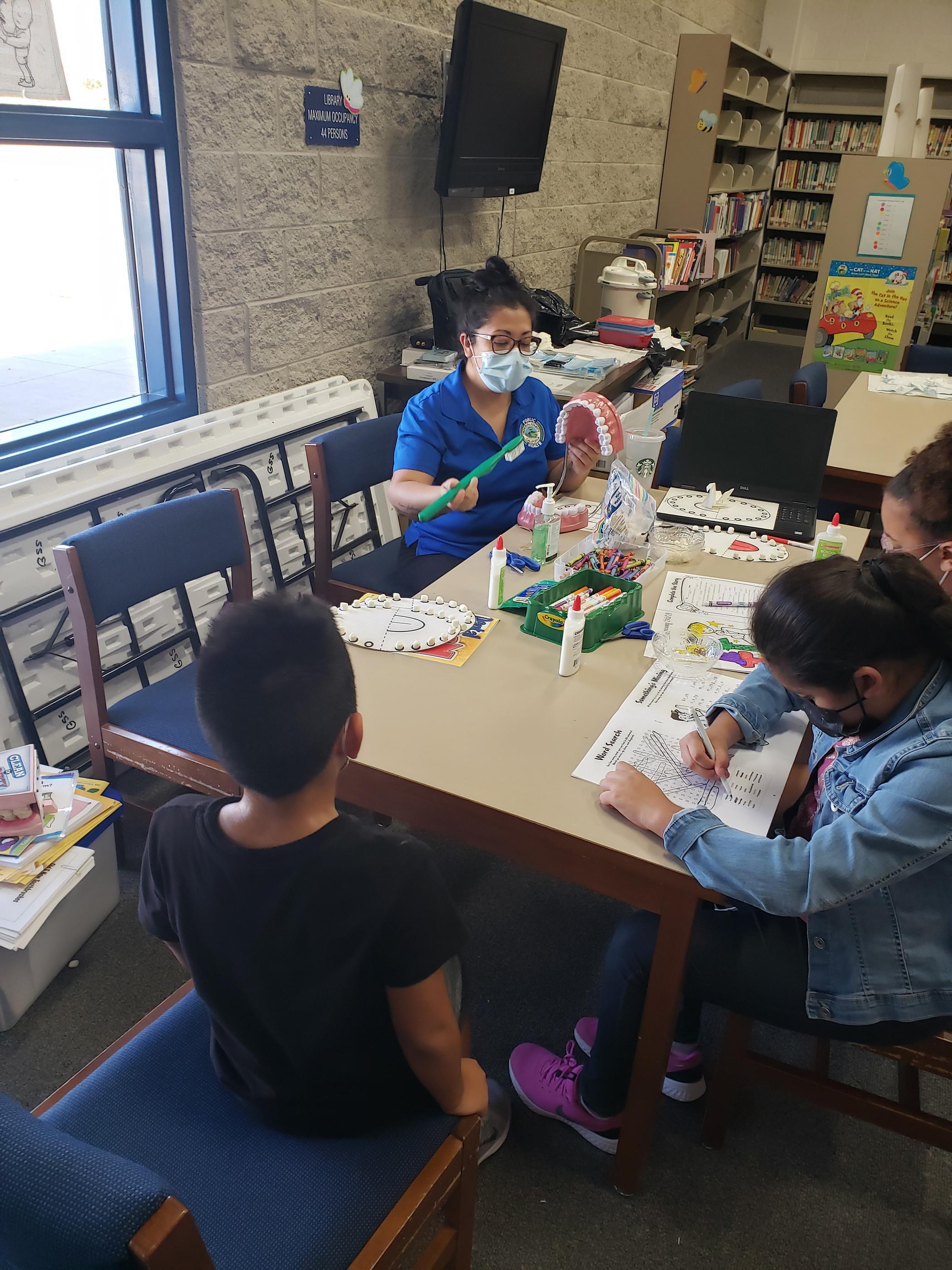 Dentist teaching kids